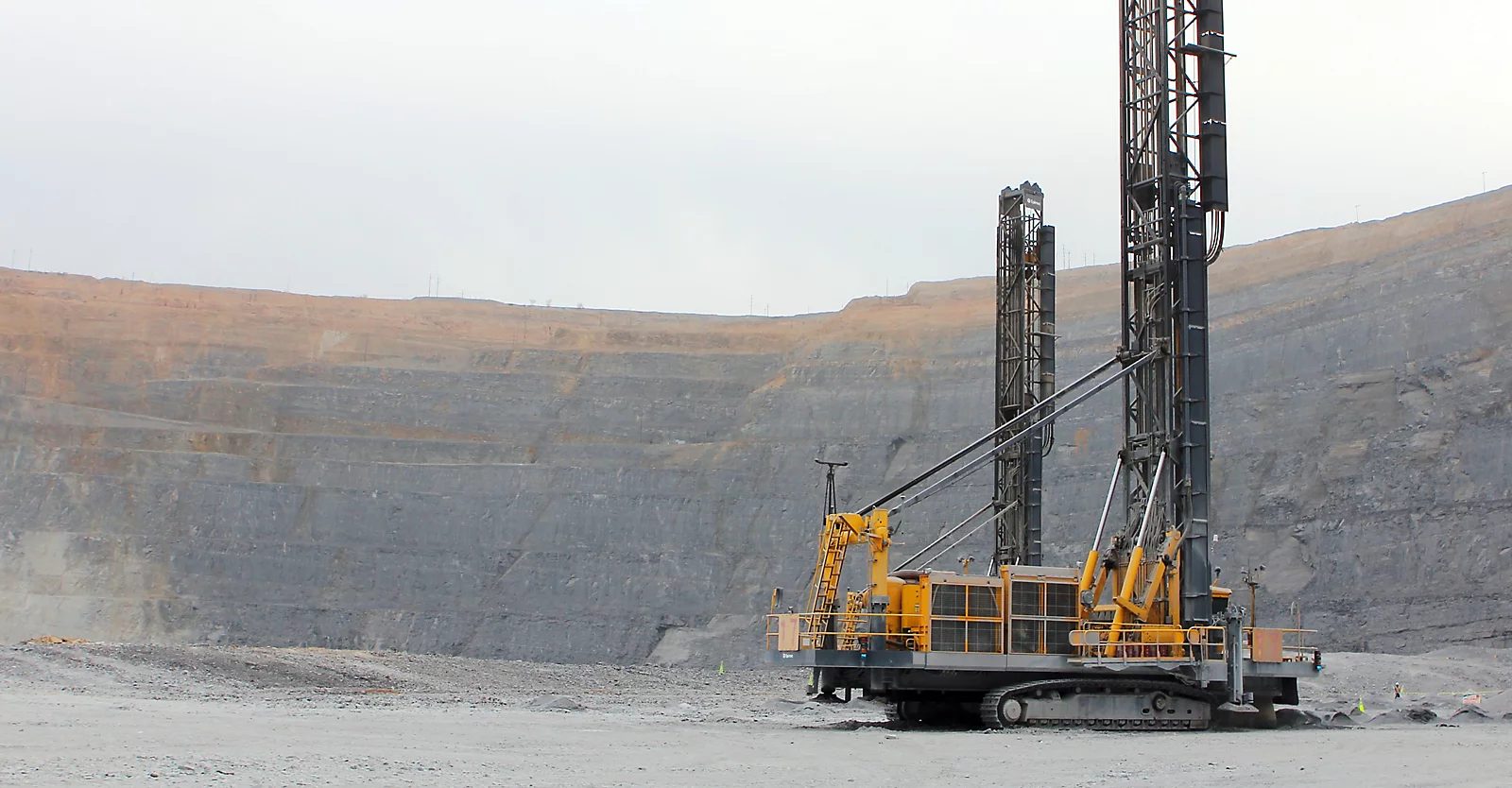 Rotary blasthole drill rigs operating in an open-cast pit