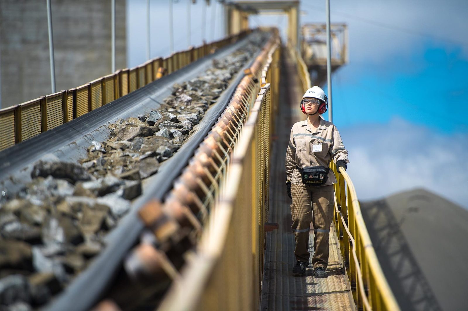 ROM ore travelling on an overland feed conveyor